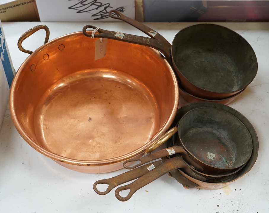 A set of five graduated copper cooking pans by E. Dehillerin of Paris, together with a copper preserve pan, 45cm. Condition - poor to fair